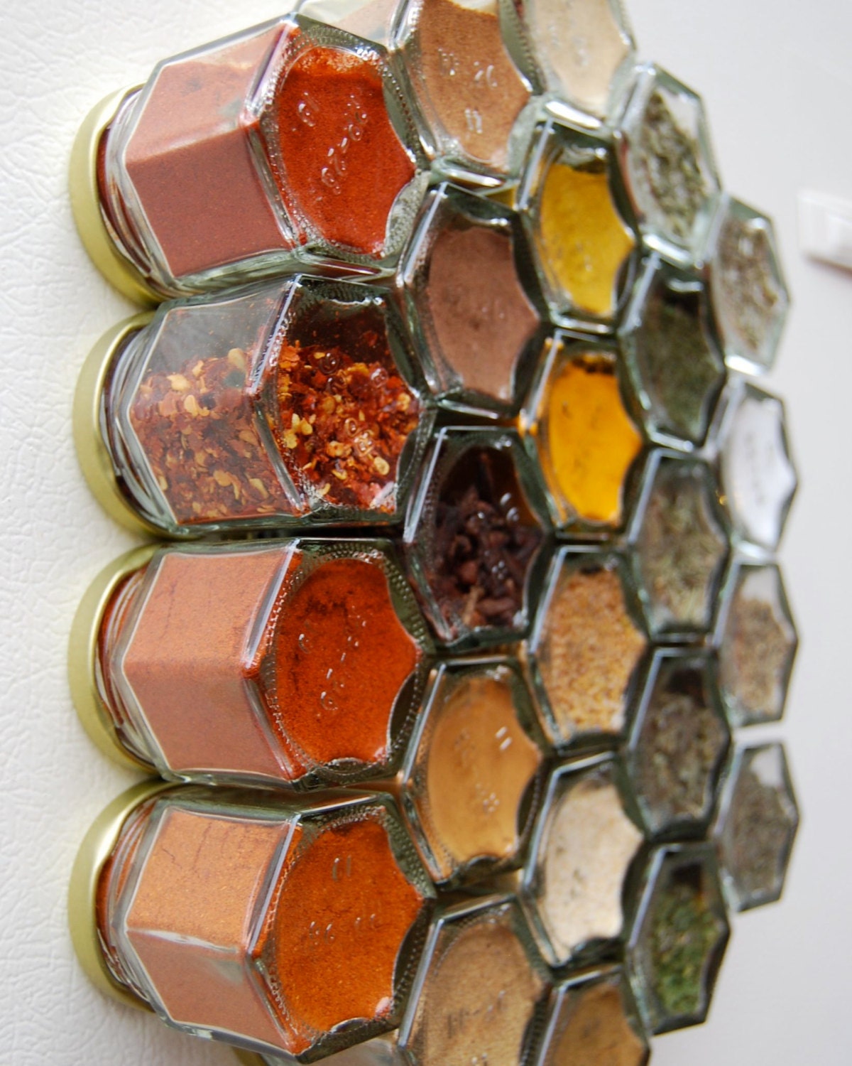 Glass Spice Jars. Customize this Magnetic Spice Rack (set of 24 empty STAMPED jars with your choice of spice names).  Free Shipping.