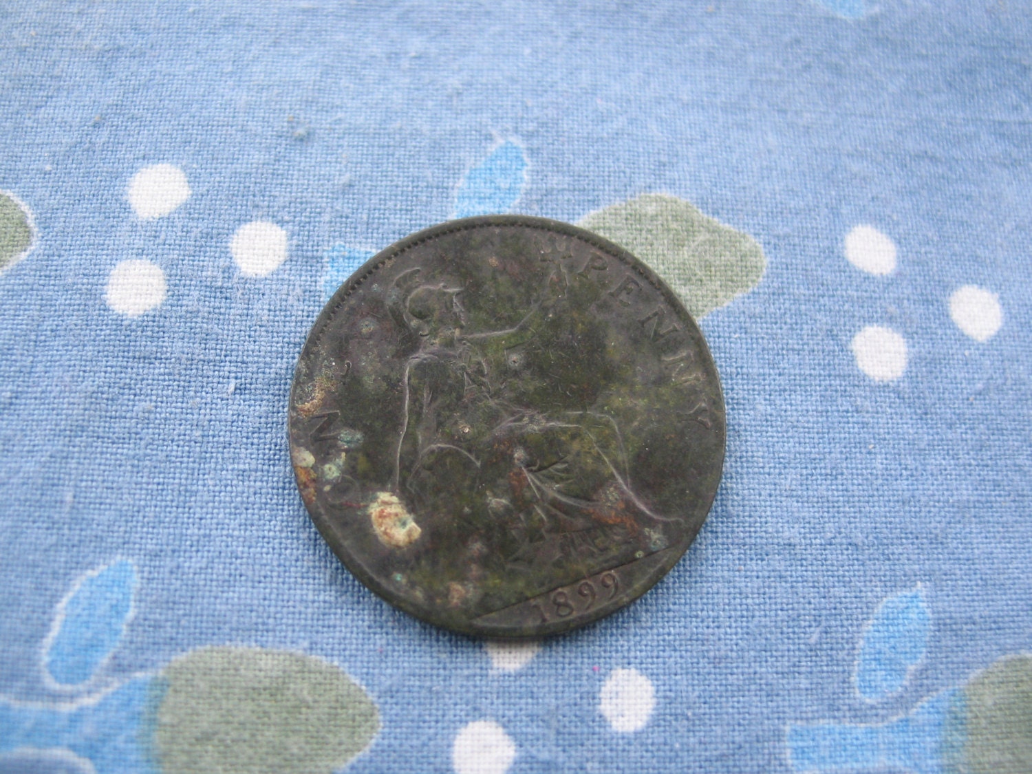 Well-worn old British Victorian penny from 1899, featuring Queen Vic herself