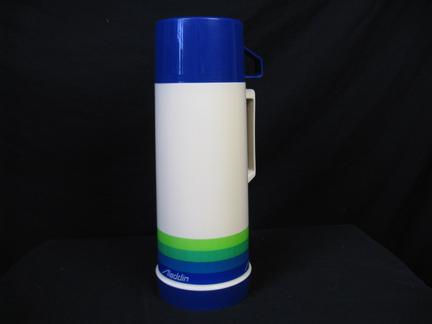 trucker 1970's aladdin insulated thermos.  glass lined. cream, blue and green.