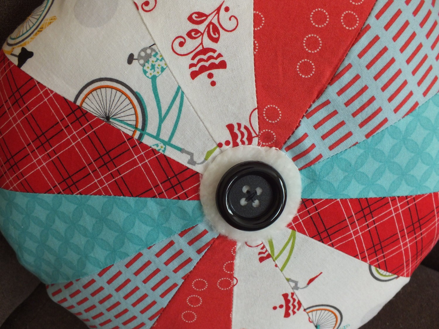 Pinwheel Pillow in Reds and Teals