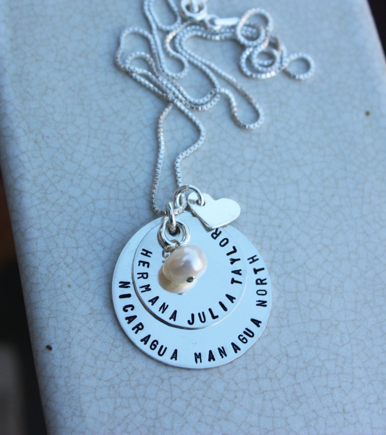 Missionary necklace, layered with a heart and charm