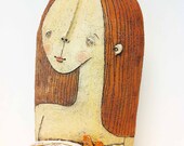 red haired woman, with fish on a plate. ceramic bust