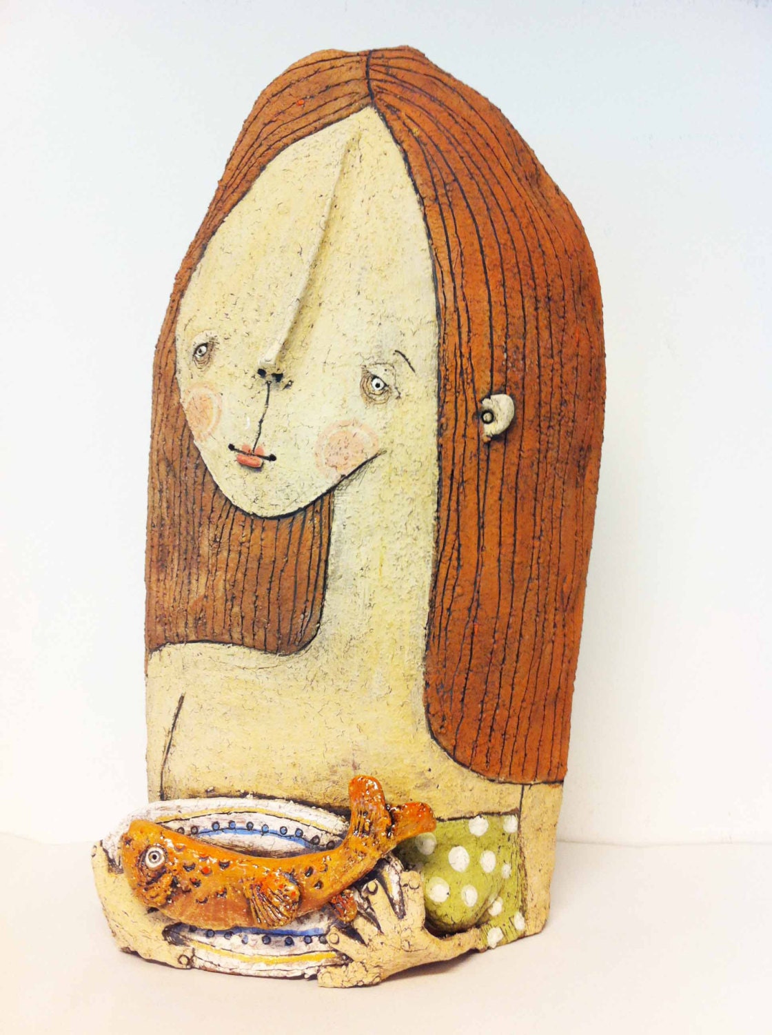 red haired woman, with fish on a plate. ceramic bust