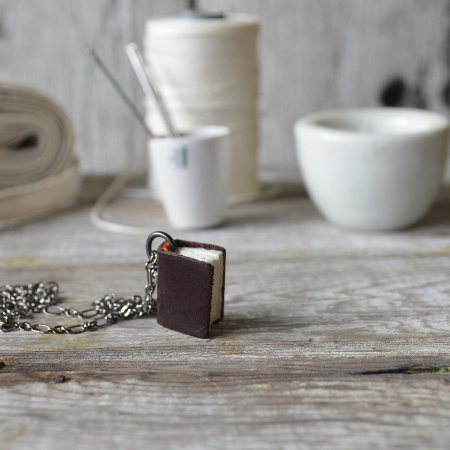 Book Necklace: Small, chocolate bit of sofa, reclaimed leather.
