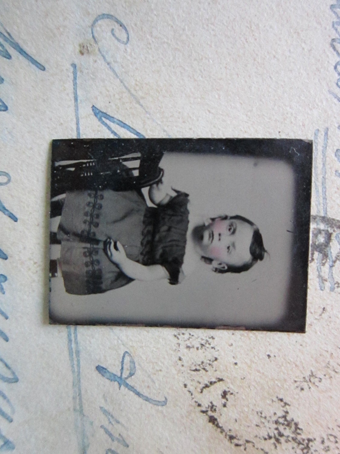 miniature GEM tintype photo - darling infant GIRL in dark dress - GTE09