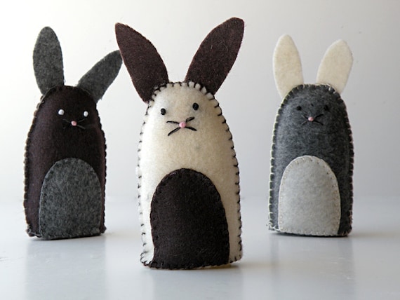 Three small felt rabbits - gray, cream and brown