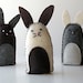 Three small felt rabbits - gray, cream and brown