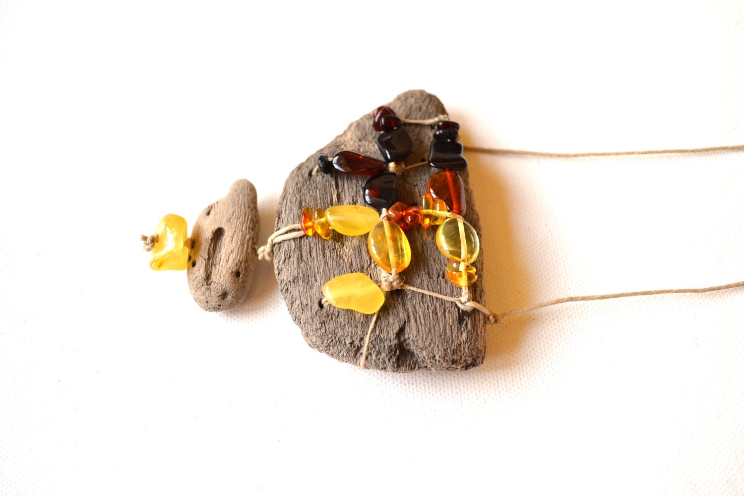 Charm/Necklace handmade from driftwood and natural Baltic Sea amber