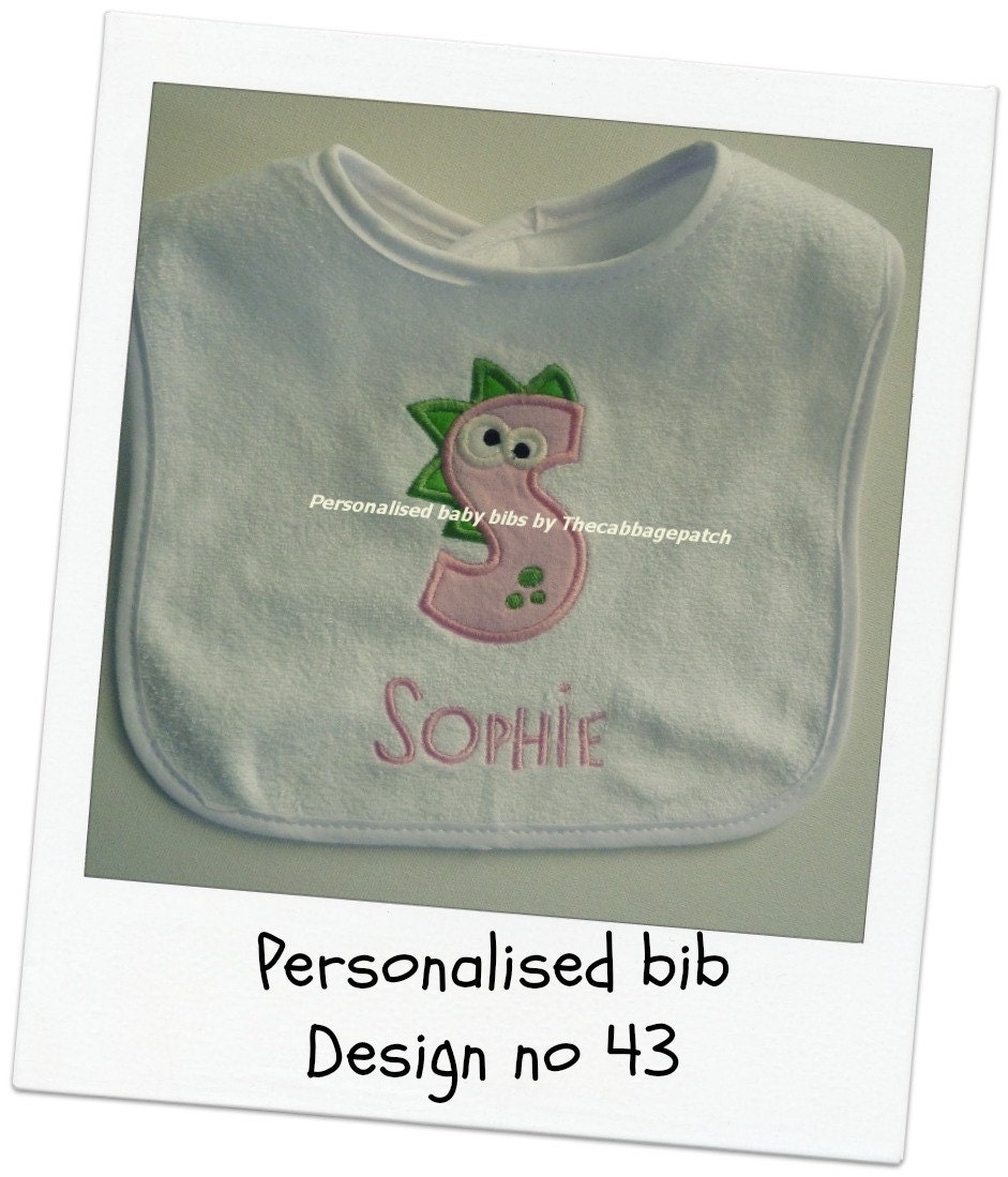 Handmade personalised baby bib Dinosaur with your choice of first name in pink or blue