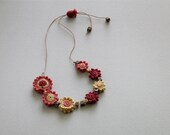 Crochet Flower Necklace in orange, yellow and red