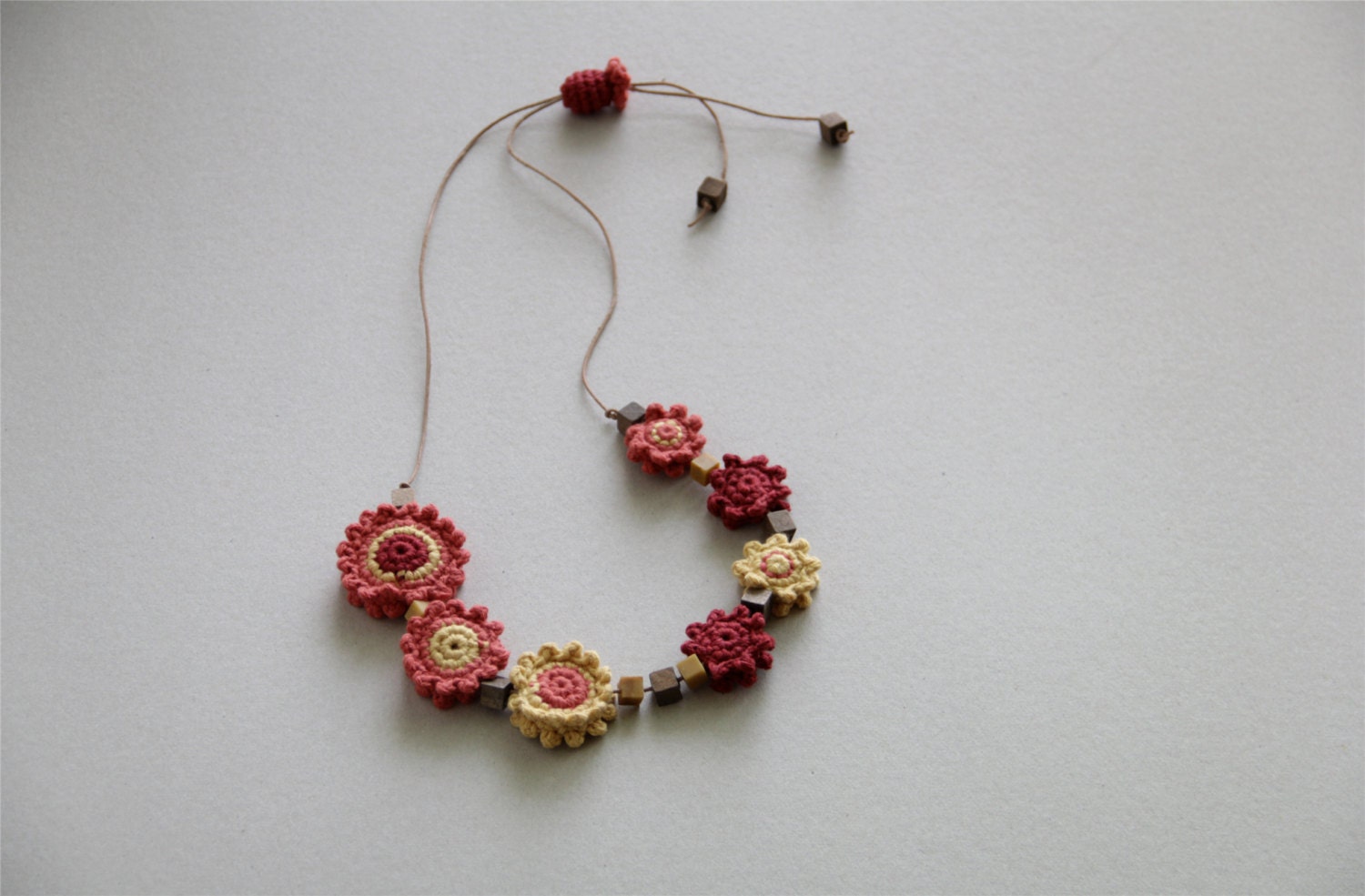 Crochet Flower Necklace in orange, yellow and red