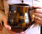 Glossy Brown Stoneware Pitcher with Texture Detail