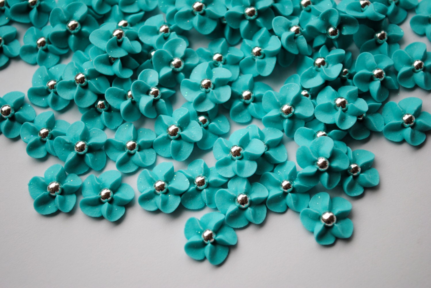 Royal Icing Flowers in Tiffany Blue with Silver Dragee Centers (100)