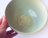 Wheel thrown ceramic bowl in celadon with Australian Flannel Flower design
