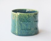 Green ceramic dish with Australian Flannel Flowers