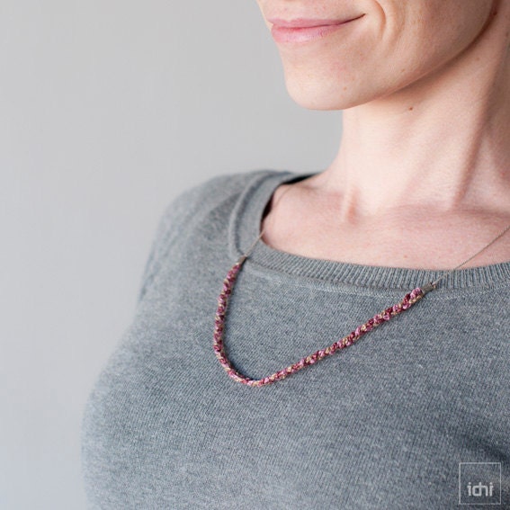 Crochet braid necklace combined with metal chain . Mauve tones .