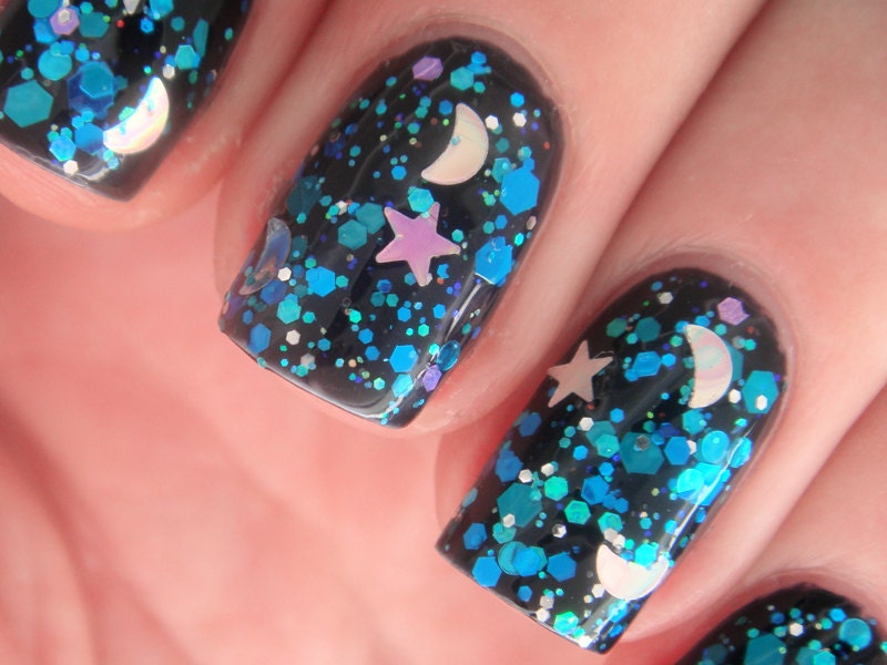 Nail polish - "Falling Skies" stars and moons with blue, teal and violet glitter in a clear base