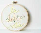 Embroidered Hoop Art. La Dolce Vita. Pastel Green, Yellow, Floral Stitching. Stitched by Merriweather Council