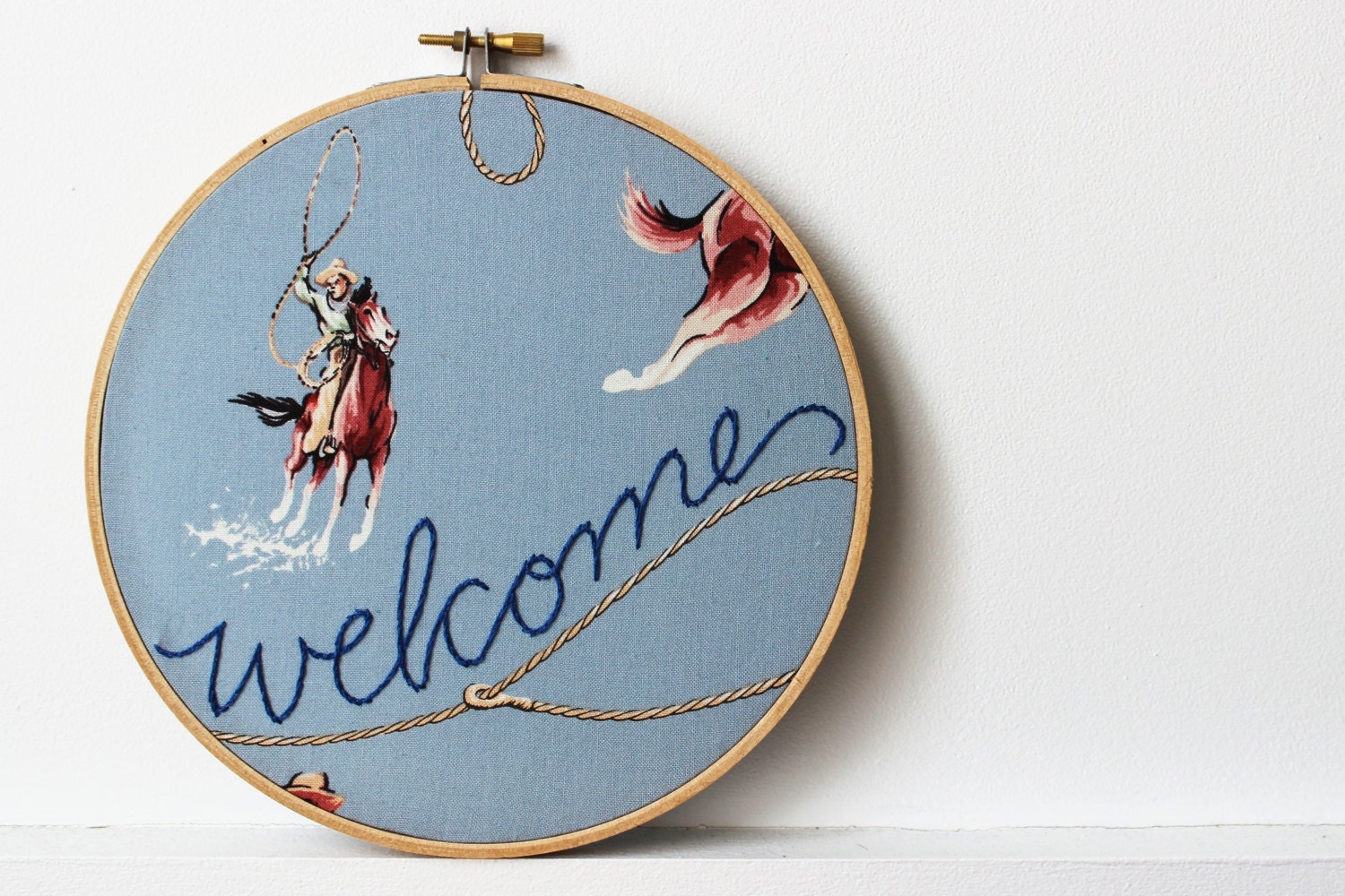 Embroidery Hoop Welcome Sign. Western, Cowboy Theme. Blue with Horses and Lasso. by Merriweather Council