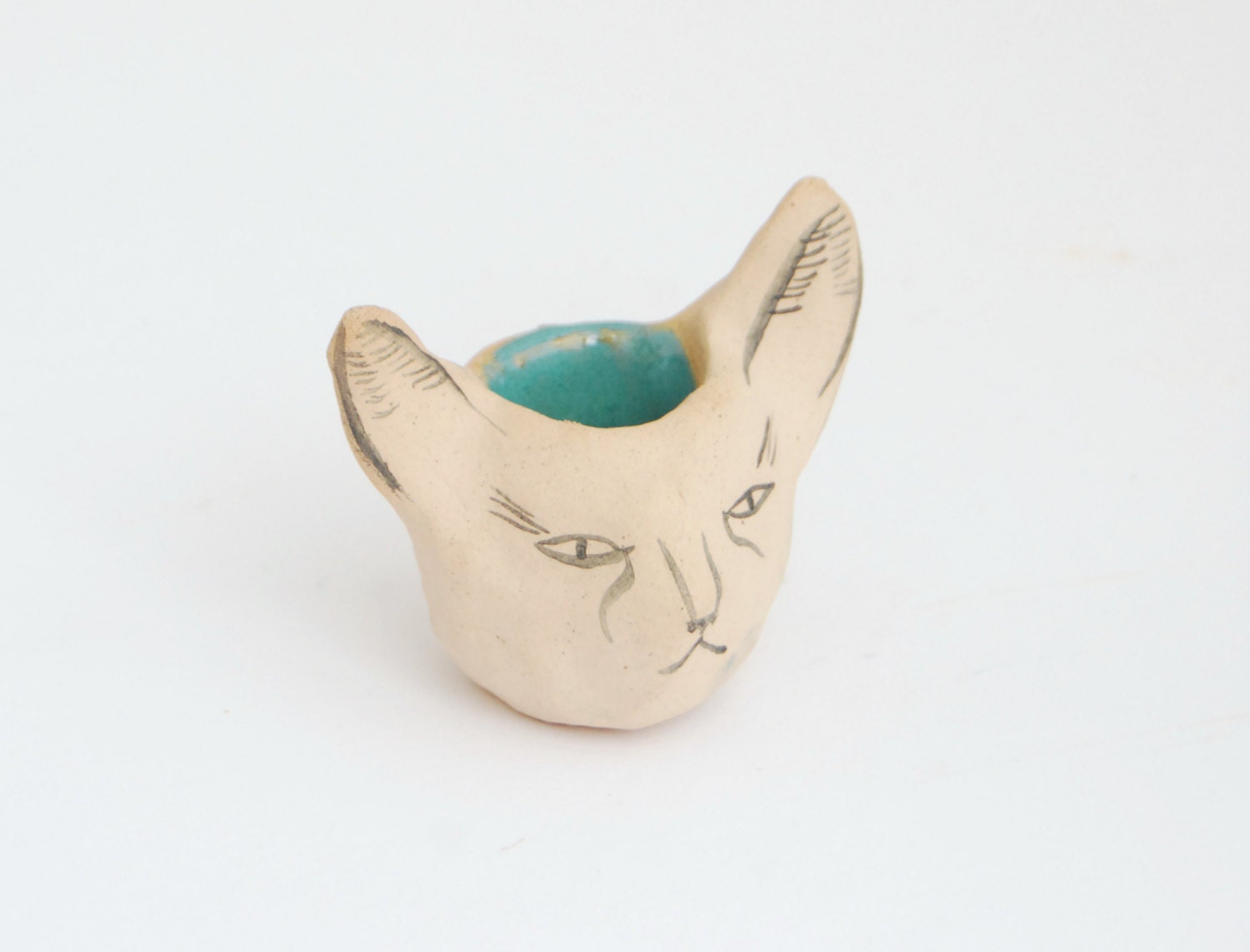 Grouchy cat ceramic candle holder in tan and turquoise