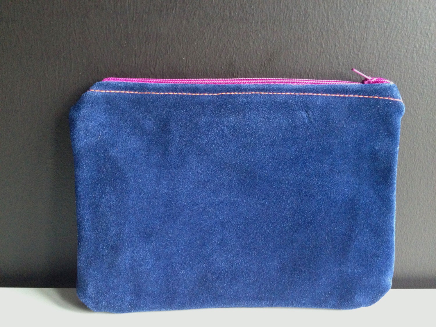 very simple leather clutch with colorful lining