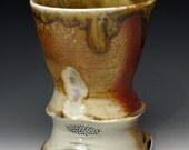 Cup, porcelain, amber glaze, avery flash, woodfired