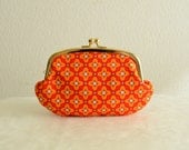 Retro mod floral clutch clasp purse for iPhone case and more.