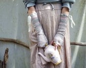 Tea Party Gauntlets, hand knitted in pale blue-gray and dusky pink sugar cane yarn with taffeta ribbon trim