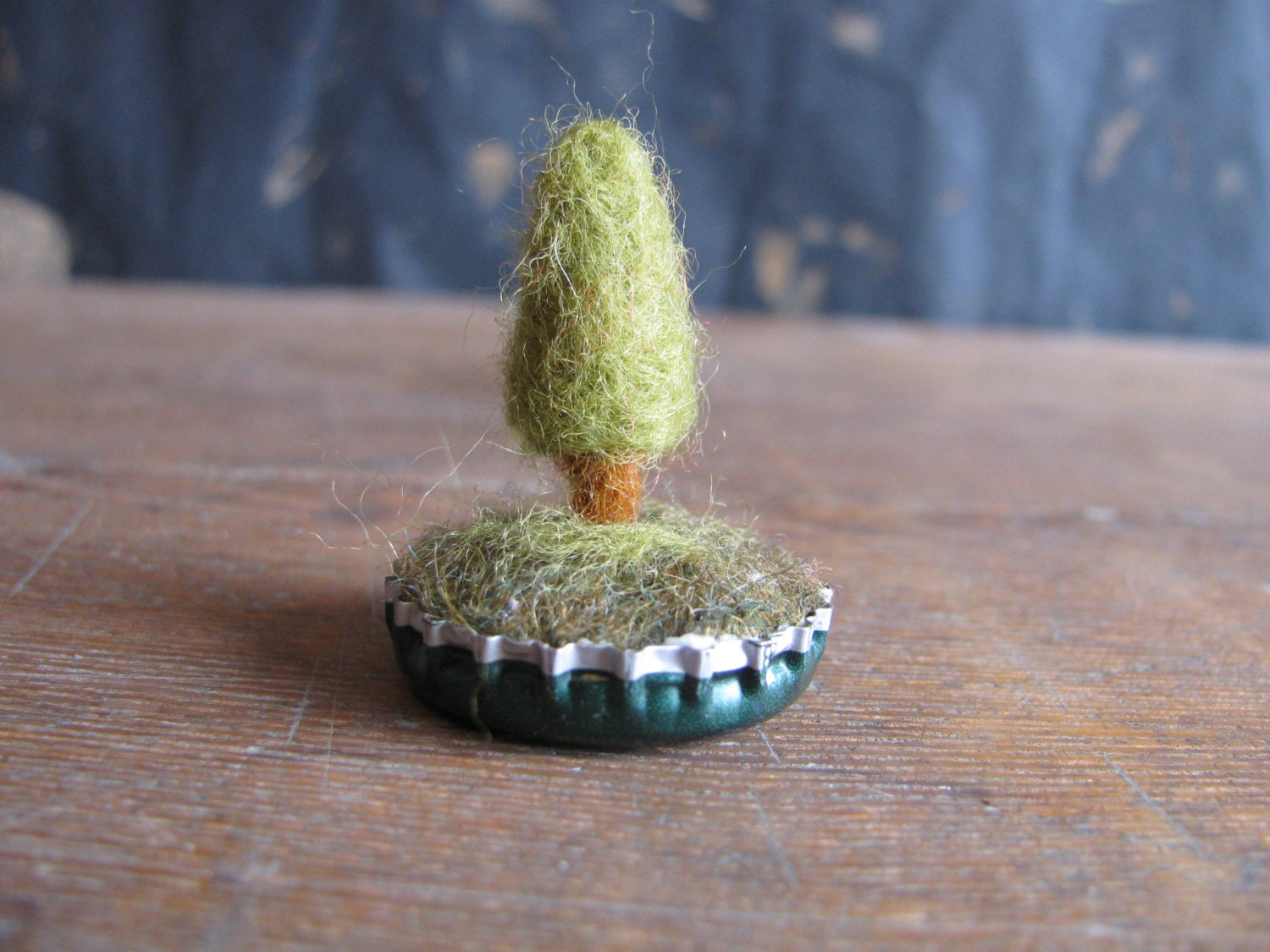 Felted wool garden, tiny tree in an upcycled bottlecap, dark green