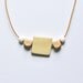 Geometric wooden bead necklace .  Natural & white