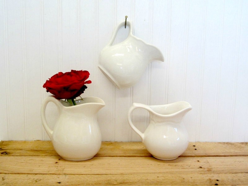 Set of Three White Ironstone Pitchers