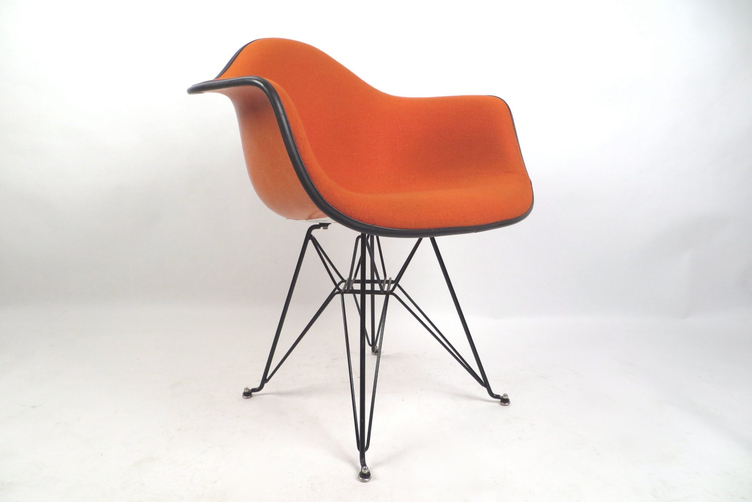 Herman Miller Eames bright orange fiberglass arm chair, free Greyhound shipping in the USA