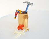 Assorted Vintage Toys in Little Wood Box Miniature Hammer Plastic Toy Plane Airplane Wood Bead Bracelet Skeleton Key Elephant Charm Red Blue