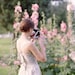Portrait of a girl taking a picture with a Polaroid - 35mm film photography - 5x7 inch (13x19cm) - Paris Art Print - Spring