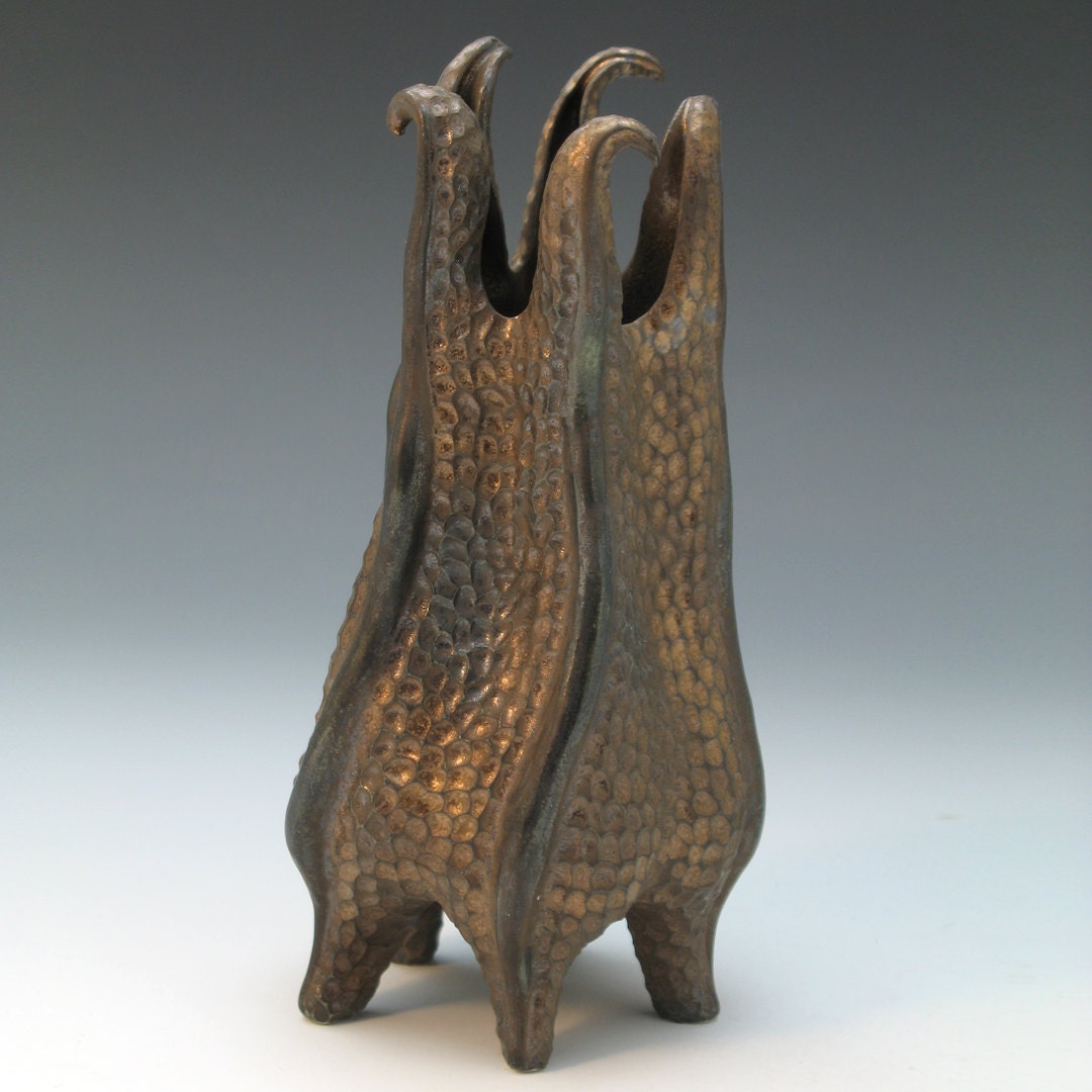 Carved porcelain vase in bronze, curly topped & textured