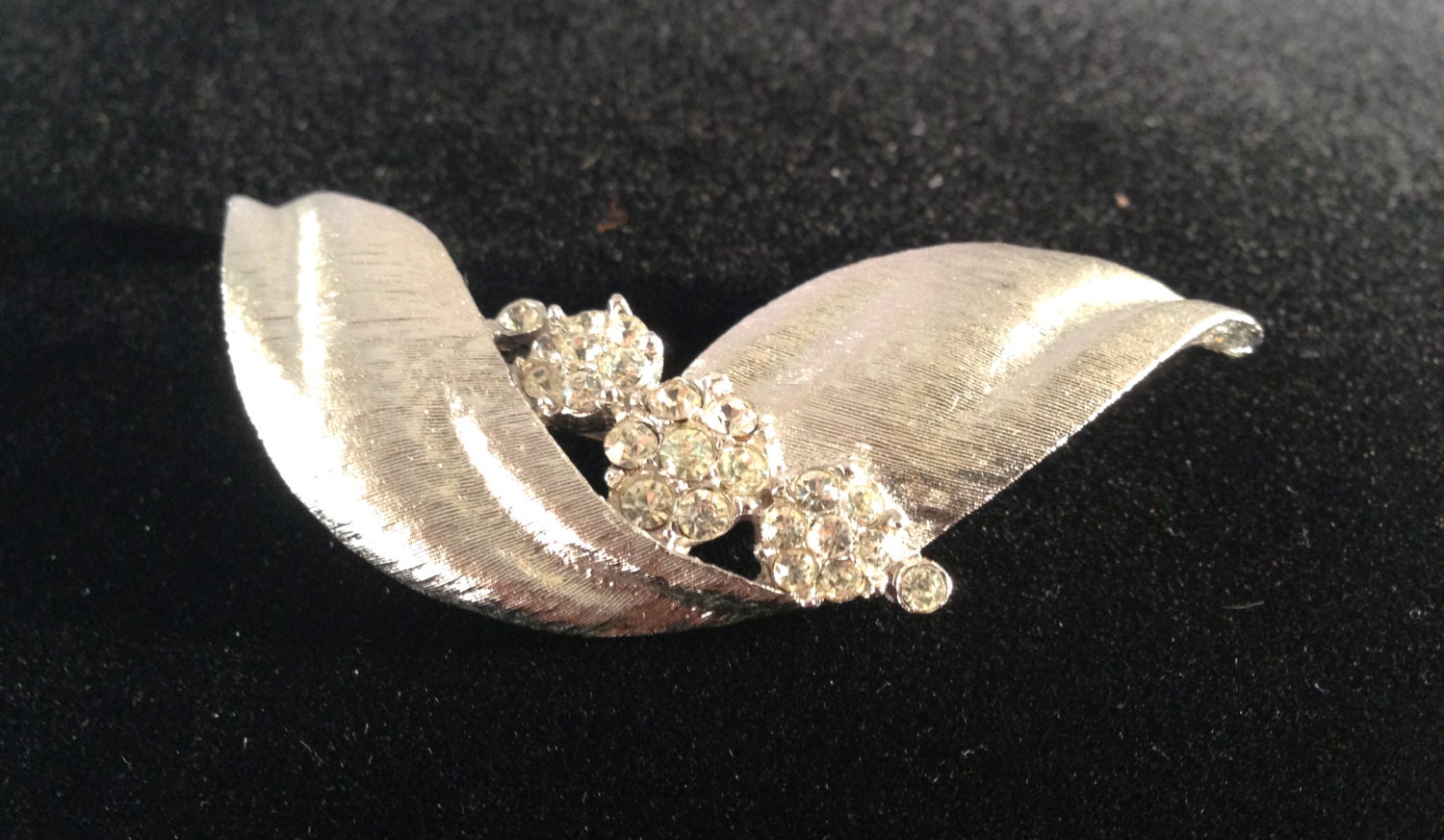 Vintage Crown Trifari Rhinestone Brooch - Stylized Curled Leaf - Matte Silver Clear Rosettes Crystals - rhinestones - silver tone - pin