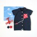 knitted short jumpsuit in navy blue with a kite, polo neck. Baby boy. 100% cotton. READY TO SHIP size newborn