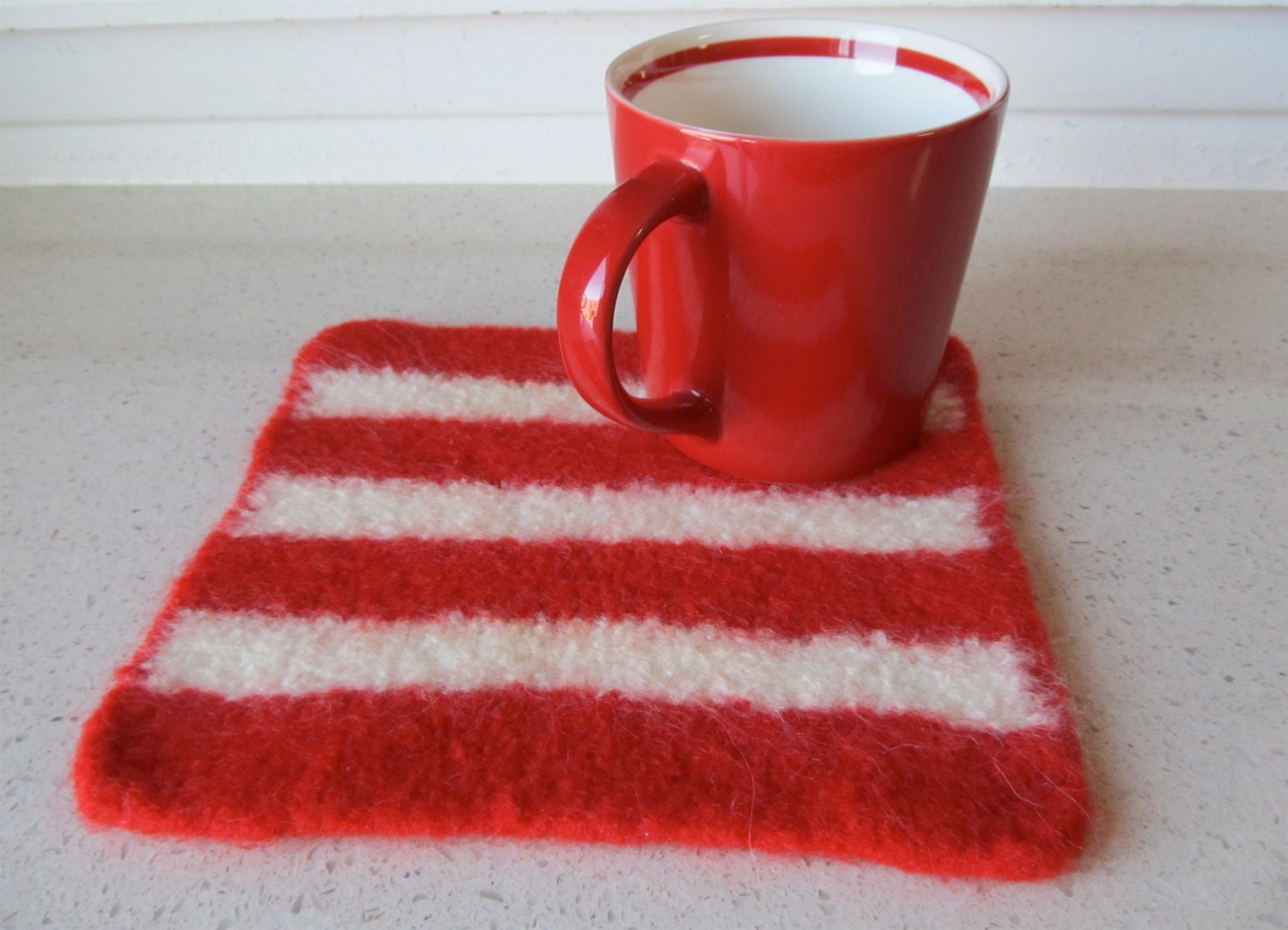 Felted striped  wool hot pad in red and winter white