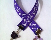 Purple ribbon bookmark with white ivy leaves and butterfly crystal
