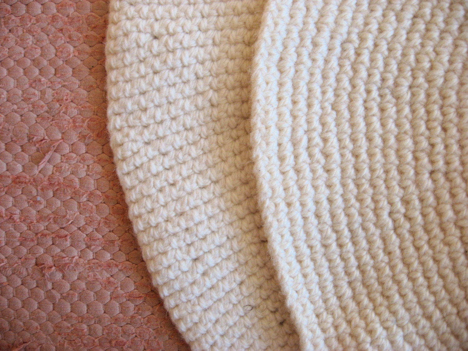 small off-white round wool rug mat