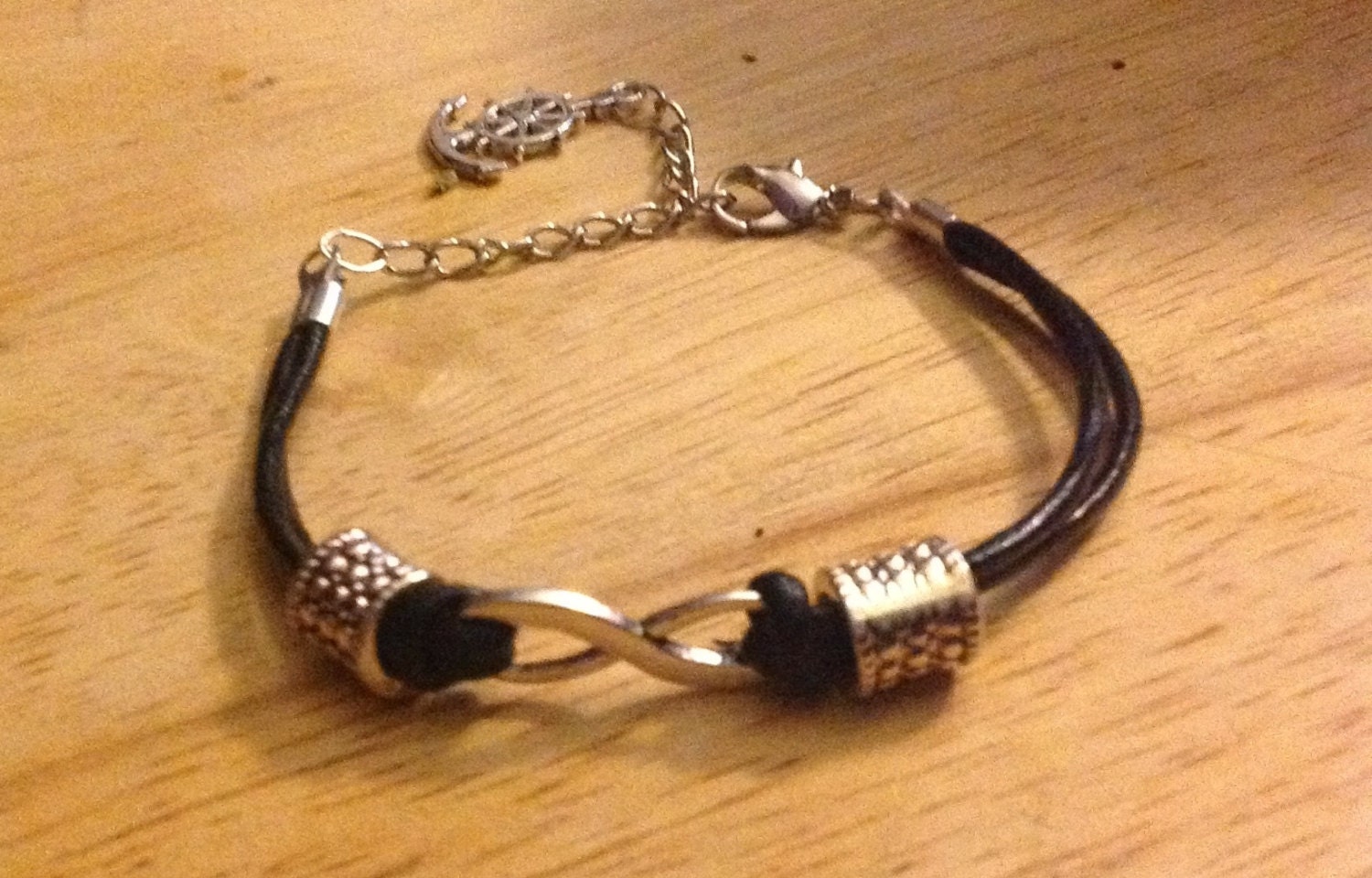 Black leather infinity bracelet w beads