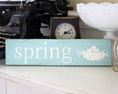 spring sign on reclaimed wood