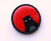 Red polkadot brooch with black cat