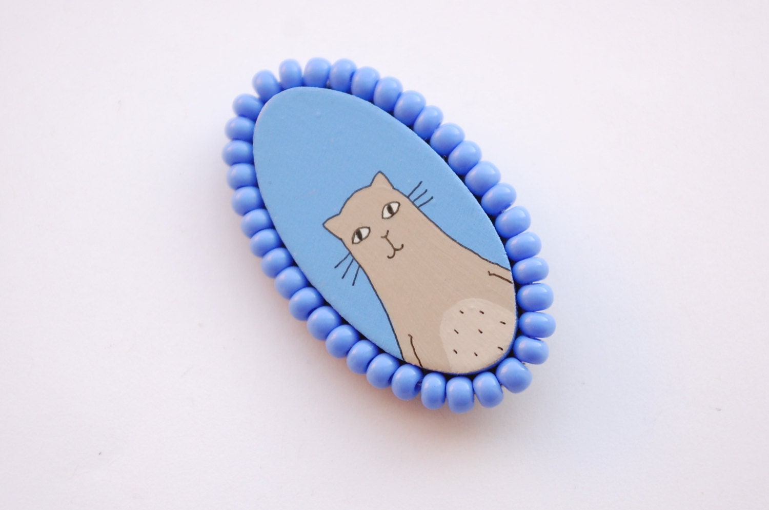 Blue Brooch with hand painted beige cat.