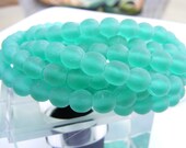 Czech Glass Beads . druk rounds . green emerald . 30 each . 6mm