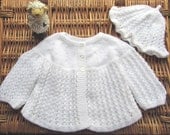 Baby's traditional white lacy matinee jacket and cap / hat