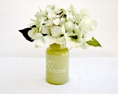 A Single Silk Sage Hydrangea In an Olive Green Vase