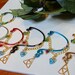 The Legend of Zelda's Wise Ear Bend with Hanging Spiritual Stones and Triforce