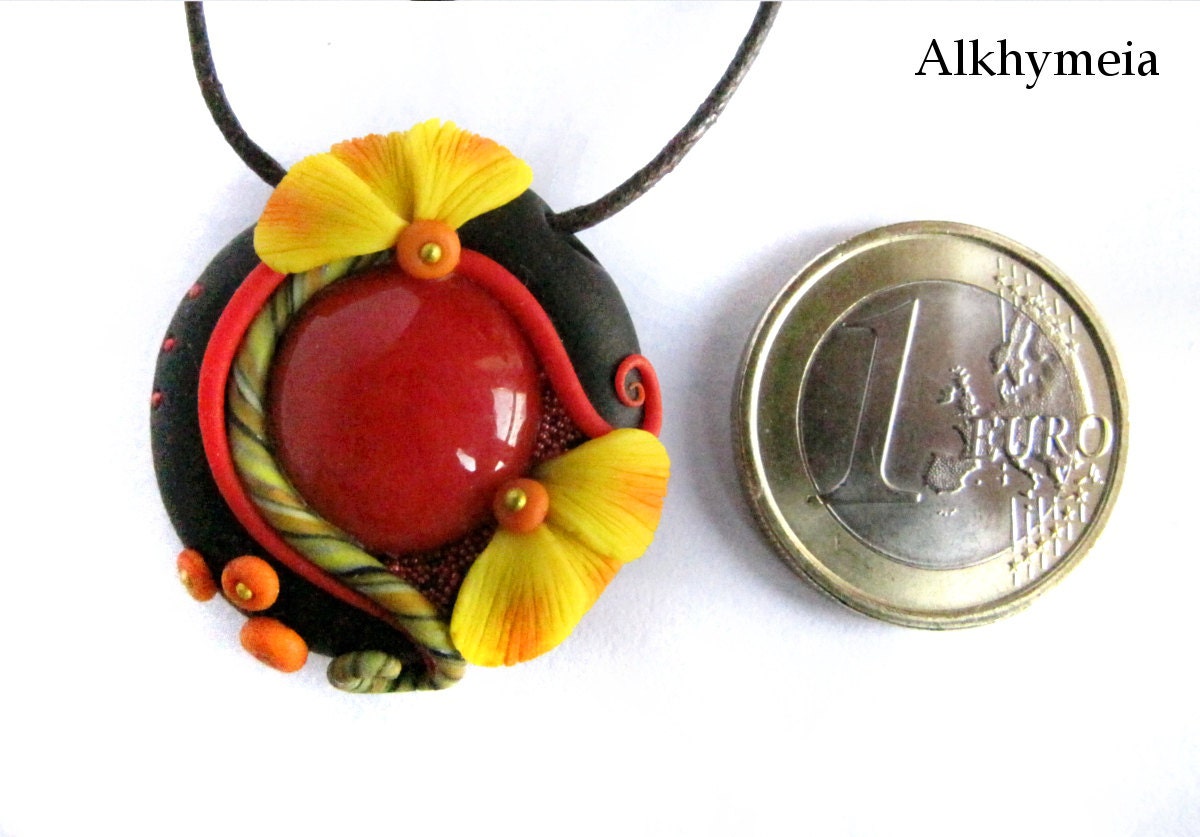 Dew Drop in Red and Yellow, a nature inspired polymer clay and glass pendant with swirls, dots and  flowers