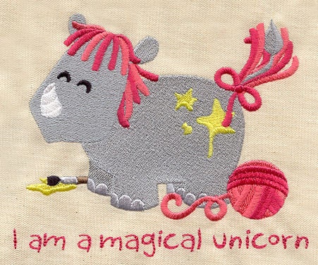 Magical Unicorn embroidered feeding bib.